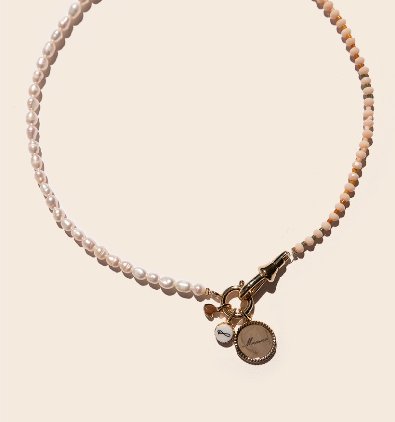 Olivia necklace with its charms