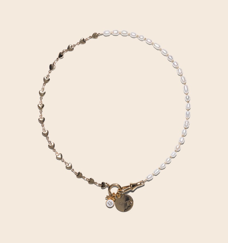 Alma necklace with its astrological sign charms