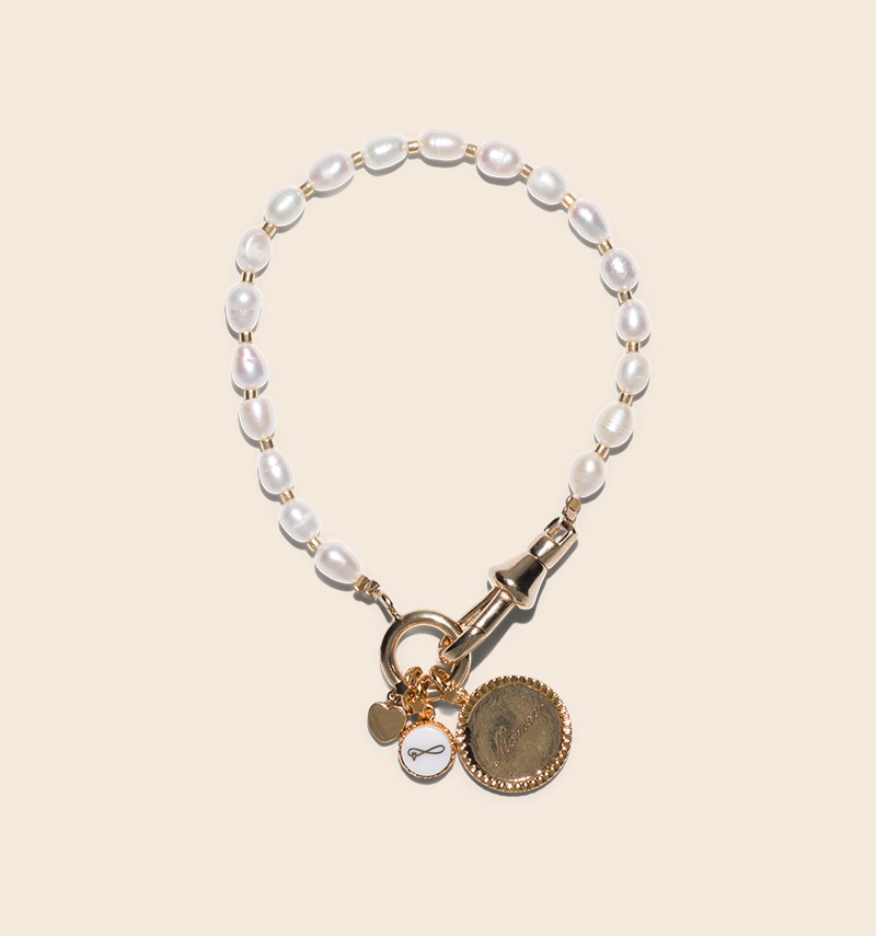 Ysée bracelet with its charms